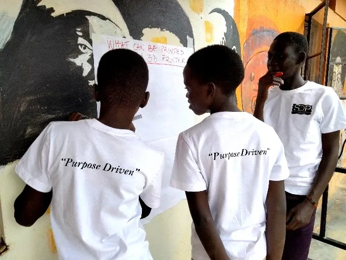 Anena Sharon with a Superchild Coaching Program cohort in Gulu City