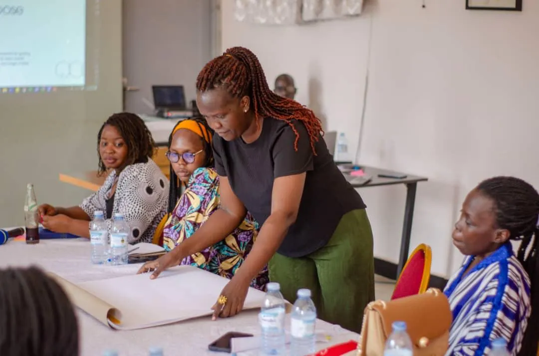 Anena Sharon leading a business training workshop for a group of participants